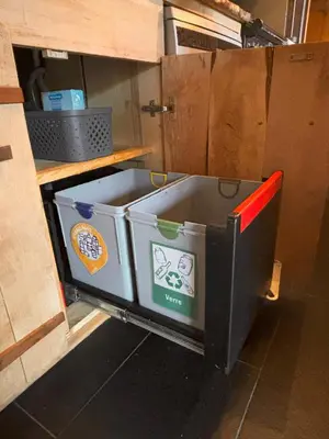 a tool box sitting in a cabinet in a kitchen at Appartement Chamonix in Chamonix-Mont-Blanc