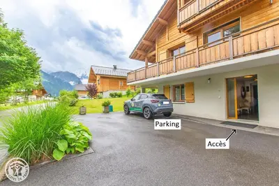 a car parked in the driveway of a house at Chalet des Morets in Saint-Gervais-les-Bains