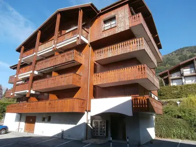 a apartment building in the middle of a snowy street at Apartment Isabella by Interhome in Saint-Gervais-les-Bains