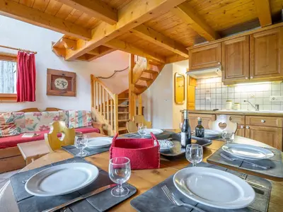 a living room with a couch and a table at Apartment Les Hauts des Chavants -2 by Interhome in Les Houches