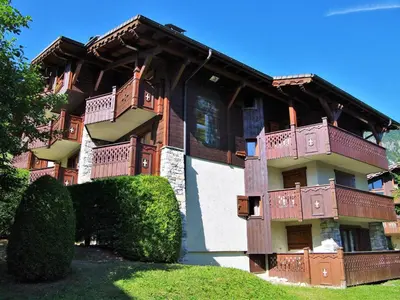 a building with balconies on the side of it at Apartment Les Hauts des Chavants -2 by Interhome in Les Houches
