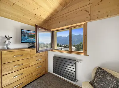 a room with a tv and some windows at GR450 6 Pers Centre Carroz in Les Carroz d'Araches