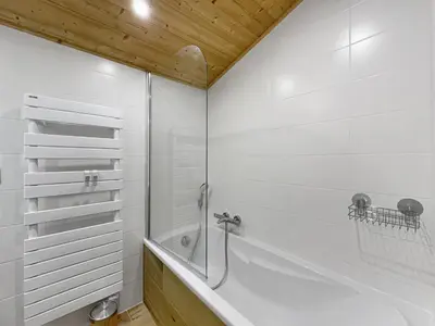 a bathroom with a shower and a bath tub at GR450 6 Pers Centre Carroz in Les Carroz d'Araches