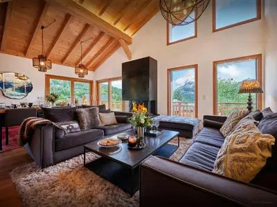 a living room with a couch and a table at Chalet Etoile Nordique - OVO Network in Saint-Gervais-les-Bains