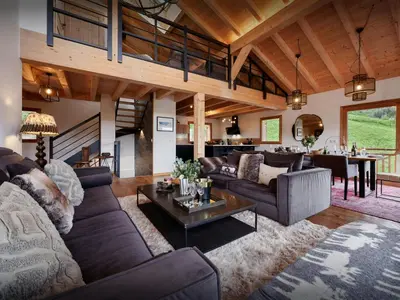 a living room with a couch and a table at Chalet Etoile Nordique - OVO Network in Saint-Gervais-les-Bains