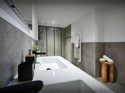 a bathroom with a white tub and a sink at Chalet Etoile Nordique - OVO Network in Saint-Gervais-les-Bains