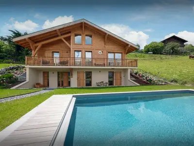 a house with a pool in front of it at Chalet Etoile Nordique - OVO Network in Saint-Gervais-les-Bains