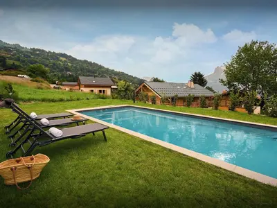 a swimming pool in the yard of a house at Chalet Etoile Nordique - OVO Network in Saint-Gervais-les-Bains