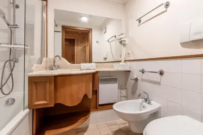 a bathroom with a sink and a toilet and a tub at Grand Balcon 3 - Calme - Vues - Cosy in Les Houches