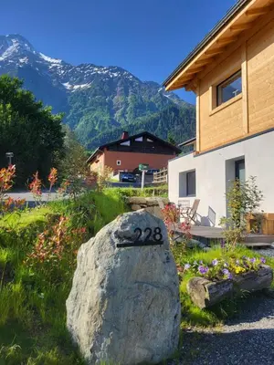 a rock with the number on it in front of a house at Studio Saint Antoine Les Houches in Les Houches