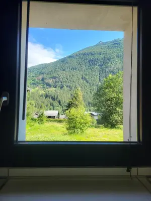 a window with a view of a mountain at Studio Saint Antoine Les Houches in Les Houches