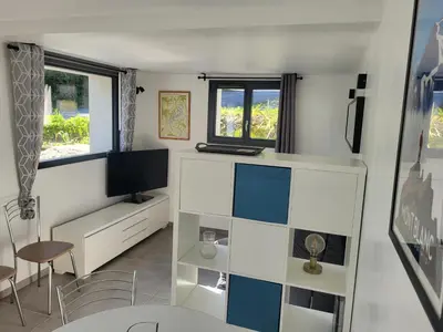 a small room with a desk and a tv at Studio Saint Antoine Les Houches in Les Houches