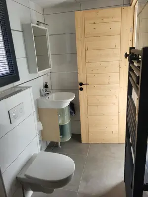 a small bathroom with a toilet and a sink at Studio Saint Antoine Les Houches in Les Houches