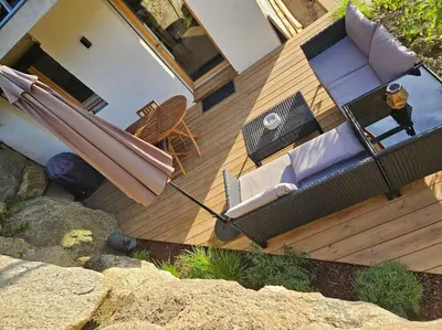 an overhead view of a patio with an umbrella at Charmant T1 montagnard proche télécabine in Saint-Gervais-les-Bains