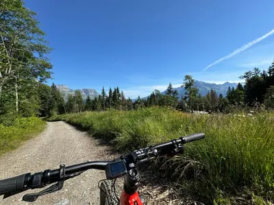 a view of the handlebars of a bike on a dirt road at Le lodge de l alpage - Ski in ski out - 2 chambres 1 cabine in Combloux
