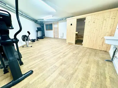 an empty room with a gym with a treadmill at Le lodge de l alpage - Ski in ski out - 2 chambres 1 cabine in Combloux
