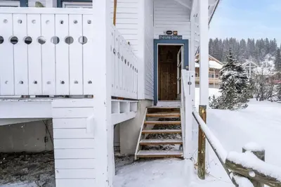 a door to a house in the snow at Les Chalets de Flaine Hameau - maeva Home - Chalet 5 Pièces 10 Personnes - Exclusive MAE-0944 in Flaine