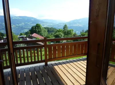 a balcony with a view of the mountains at Premier étage d'une ferme rénovée in Passy