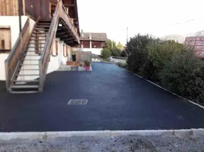 an empty parking lot with a staircase in a building at Premier étage d'une ferme rénovée in Passy