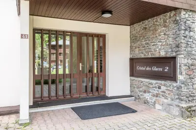 a front door of a building with a sign on it at Lac des Gaillands - Renove - Balcon avec vues in Chamonix-Mont-Blanc
