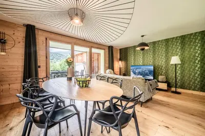 a dining room with a table and chairs at Apartment Lupin Megève - by EMERALD STAY in Megève