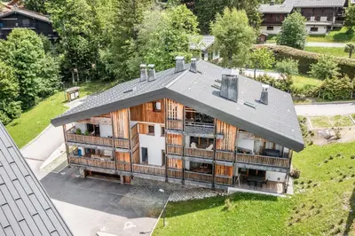 an aerial view of a house with a roof at Apartment Lupin Megève - by EMERALD STAY in Megève