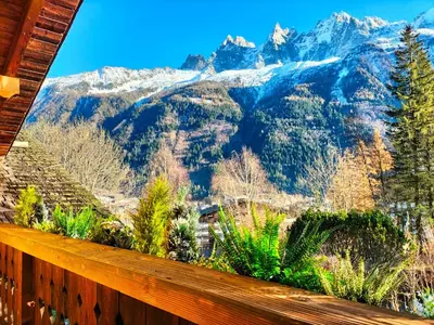 a view of the mountains from a balcony of a house at Three Bedroom Chalet Lemon Pit Chamonix in Chamonix-Mont-Blanc