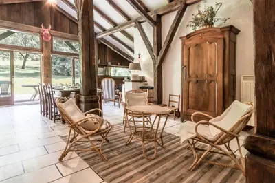 a dining room with a table and chairs in a room at La Poya haut - Calme - Vues magnifiques in Les Houches