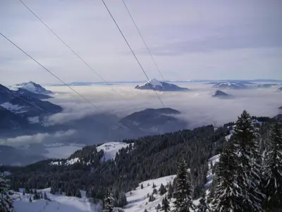 a view from a ski lift of a snow covered mountain at SAMOENS appartement proche du centre in Samoëns