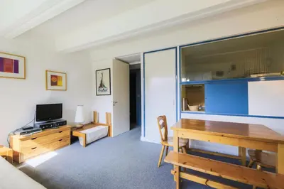 a living room with a desk and a television at Résidence Aldébaran - maeva Home - Appartement 2 Pièces 6 Personnes - Confort MAE-3790 in Arâches-la-Frasse