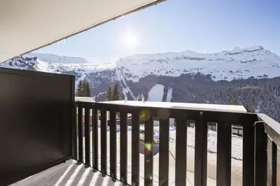 a balcony with a view of a snow covered mountain at Résidence Gémeaux - maeva Home - Appartement 2 Pièces 6 Personnes - Confort MAE-3874 in Arâches-la-Frasse