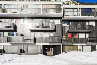 an apartment building with snow in front of it at Résidence Gémeaux - maeva Home - Appartement 2 Pièces 6 Personnes - Confort MAE-3874 in Arâches-la-Frasse