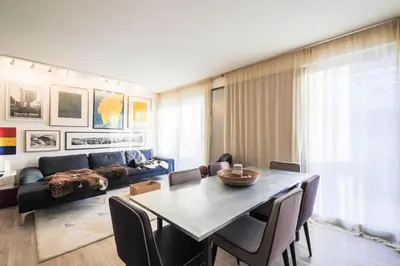 a living room with a table and a couch at Résidence La Petite Ourse - maeva Home - Appartement 3 Pièces 8 Personnes - Confort MAE-3901 in Arâches-la-Frasse