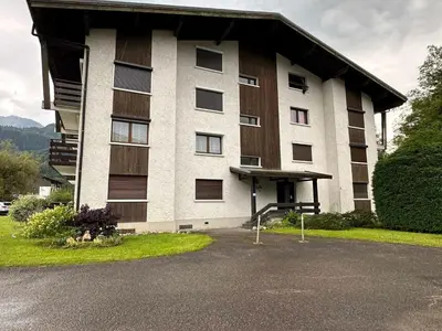 a large apartment building with a lot of windows at Studio cocooning à Samoëns avec balcon et WiFi au centre - FR-1-624-160 in Samoëns