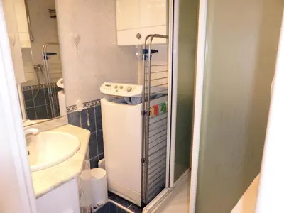 a small bathroom with a sink and a refrigerator at Résidence Pierres Blanches - Pierres Blanches F392 MAE-9901 in Les Contamines-Montjoie