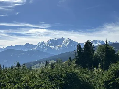 a view of a snow covered mountain in the distance at Appartement 3 Pièces + Mezzanine, 7 couchages, vue Mont-Blanc, Parking - FR-1-597-177 in Combloux