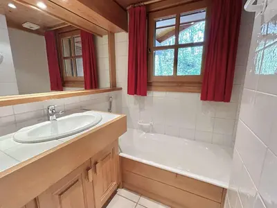 a bathroom with a sink and a bath tub at Appartement 3 Pièces + Mezzanine, 7 couchages, vue Mont-Blanc, Parking - FR-1-597-177 in Combloux