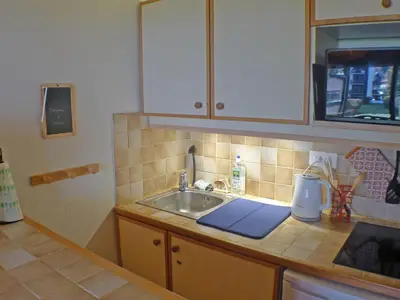 a kitchen with a sink and a counter top at Studio cabine pour 4 pers, animaux acceptés, internet, vue montagne - FR-1-629-136 in Samoëns