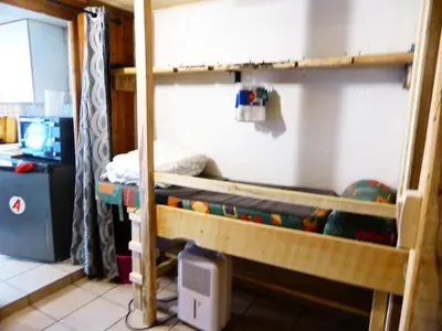 two bunk beds in a room with a computer at Résidence L'air Du Temps - L'Air du Temps 10 MAE-1321 in Les Contamines-Montjoie