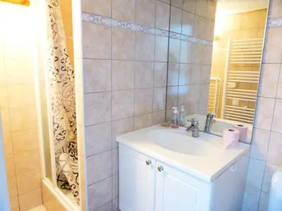 a bathroom with a sink and a mirror at Résidence L'air Du Temps - L'Air du Temps 10 MAE-1321 in Les Contamines-Montjoie