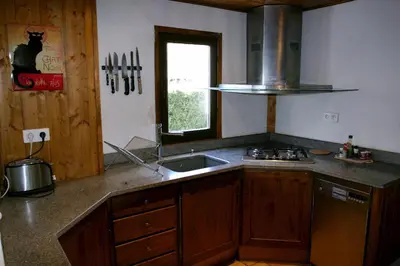 a kitchen with a sink and a stove and a window at Ideal For all type of families 