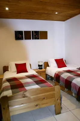 two beds in a room with at Ideal For all type of families 
