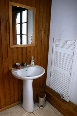 a bathroom with a white sink and a window at Ideal For all type of families 