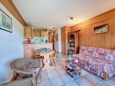 a living room with a couch and a table at Appartement 2 chambres avec jardin au pied du Mont Blanc - FR-1-560-144 in Combloux