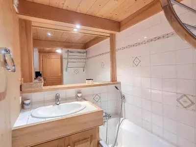 a bathroom with a sink and a mirror at Appartement 2 chambres avec jardin au pied du Mont Blanc - FR-1-560-144 in Combloux