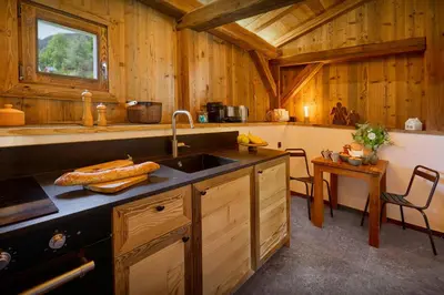 a kitchen with a sink and a counter top at Petit Mazot La Chandelle - OVO Network in Bionnassay
