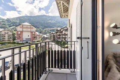 a balcony with a view of a city at Le 202 - Proche telecabine - Vue Montagne in Saint-Gervais-les-Bains