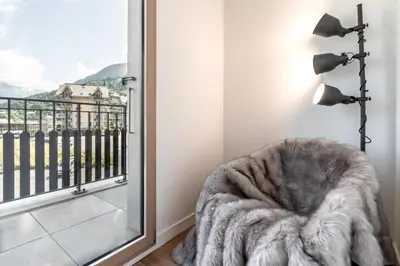 a room with a furry chair next to a window at Le 202 - Proche telecabine - Vue Montagne in Saint-Gervais-les-Bains