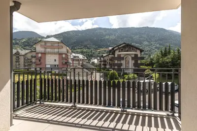 a balcony with a view of a city at Le 203 - Proche telecabine - centre ville in Saint-Gervais-les-Bains