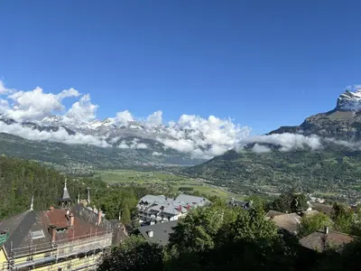 a view of a town with mountains in the background at Le 203 - Proche telecabine - centre ville in Saint-Gervais-les-Bains